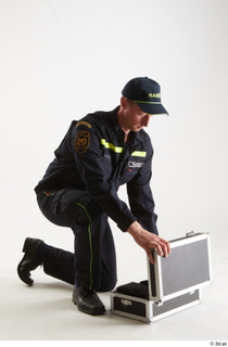 Sam Atkins Fireman Pose with Case kneeling whole body 0016.jpg